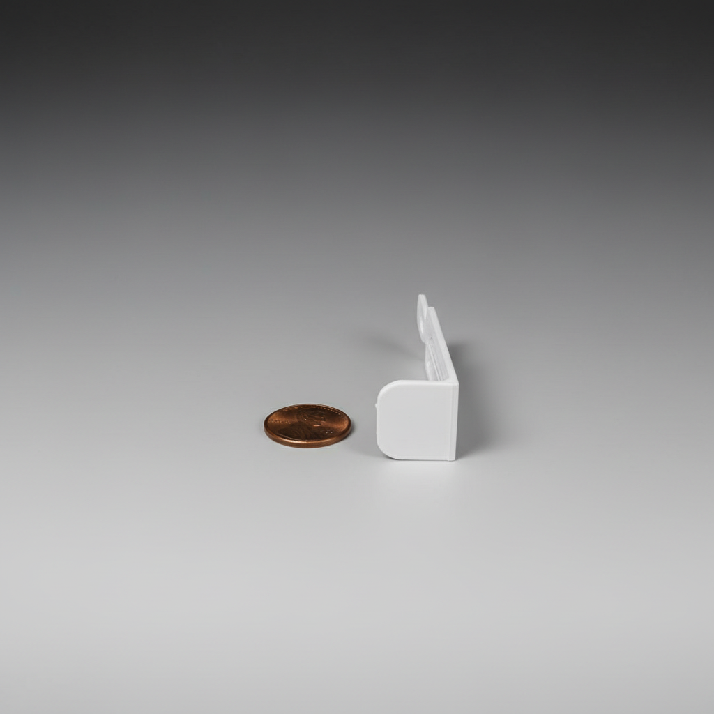 3D printed foam blaster target base piece with penny for scale